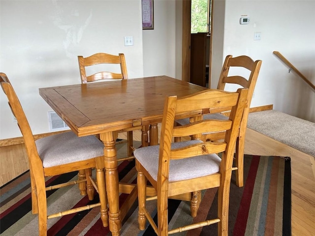 dining area with hardwood / wood-style flooring