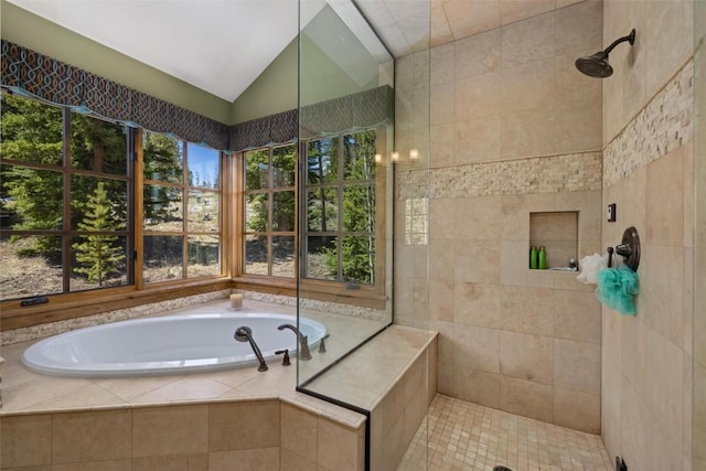 bathroom featuring vaulted ceiling and separate shower and tub