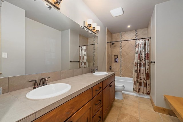 full bathroom with vanity, toilet, and shower / bath combo with shower curtain