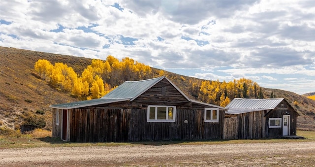 view of outbuilding with a mountain view