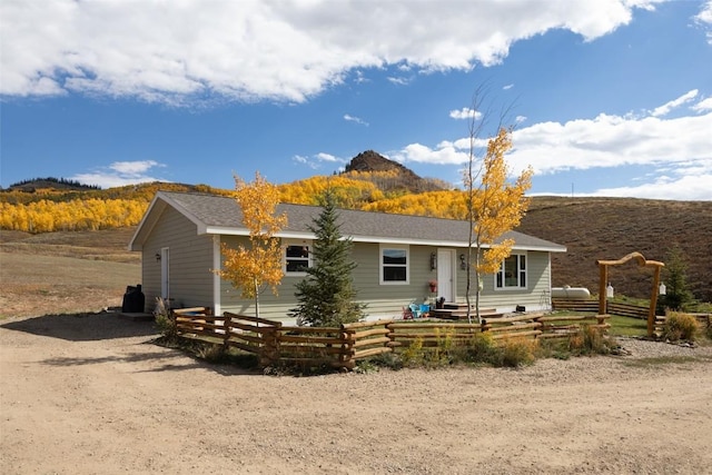 back of house featuring a mountain view