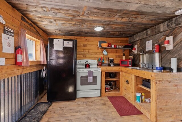 kitchen with black refrigerator, wood ceiling, wooden walls, and electric stove