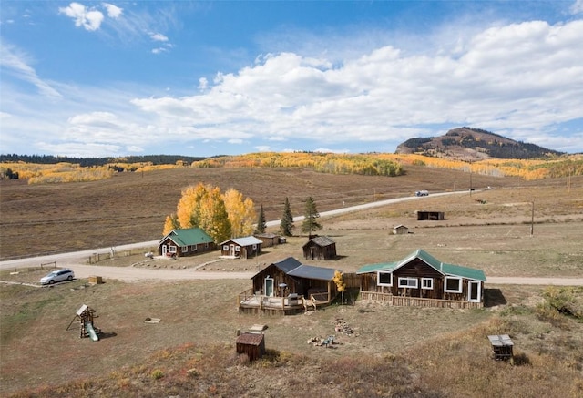 aerial view with a mountain view and a rural view