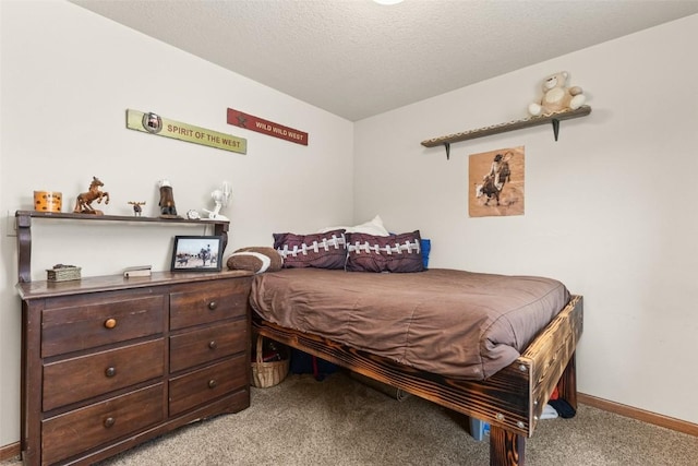 carpeted bedroom featuring a textured ceiling