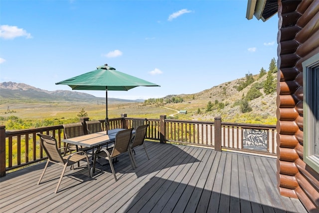 wooden deck with a mountain view