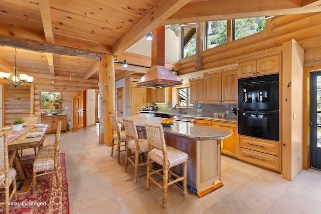 kitchen featuring backsplash, black double oven, log walls, beamed ceiling, and a kitchen island