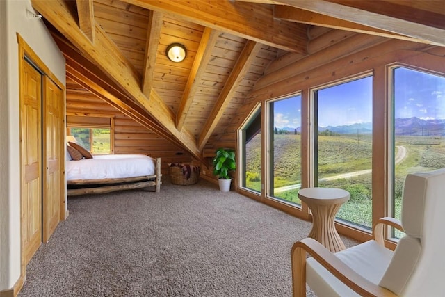 interior space with carpet flooring, vaulted ceiling with beams, and wooden ceiling