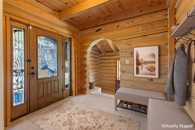 tiled foyer entrance featuring beamed ceiling, log walls, and wooden ceiling