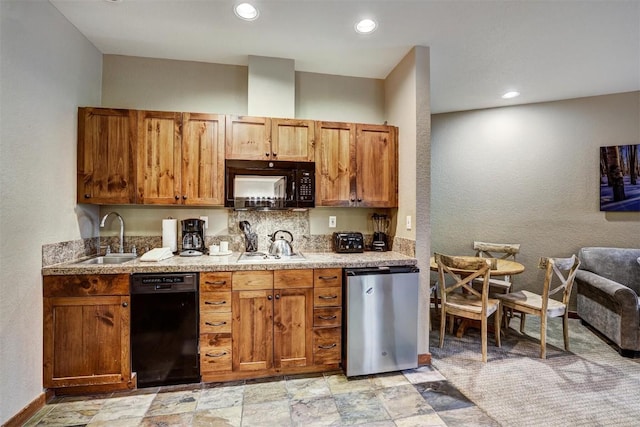 kitchen featuring black appliances, tasteful backsplash, and sink