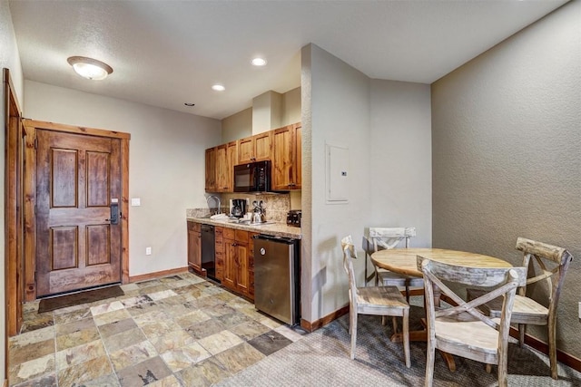 kitchen with decorative backsplash and black appliances