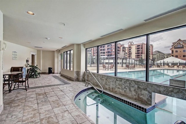 view of swimming pool featuring an indoor in ground hot tub