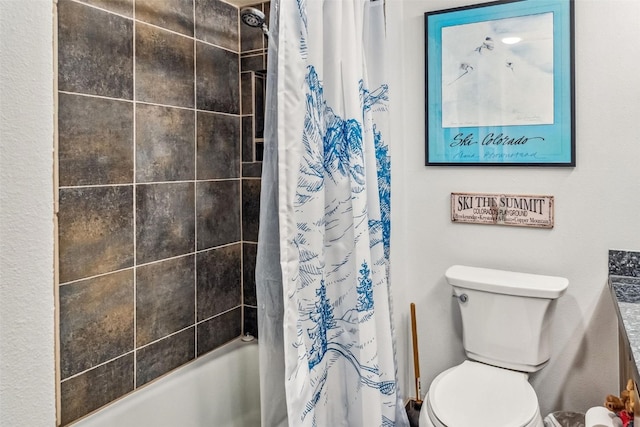 full bathroom featuring vanity, shower / bath combination with curtain, and toilet