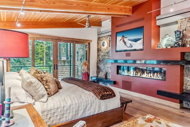 bedroom with access to exterior, french doors, wood ceiling, and light wood-type flooring