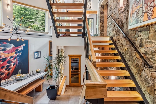 staircase with a high ceiling