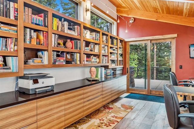 office with vaulted ceiling with beams, light wood-type flooring, and wood ceiling