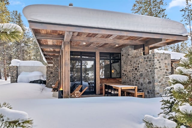 view of snow covered patio