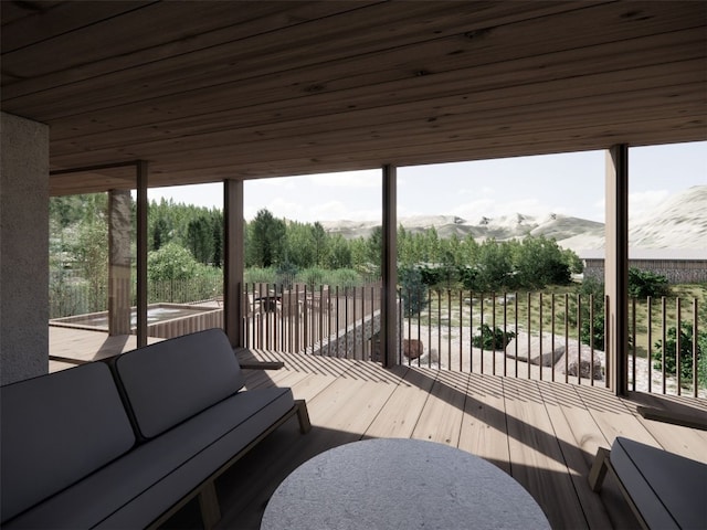 wooden deck featuring a mountain view