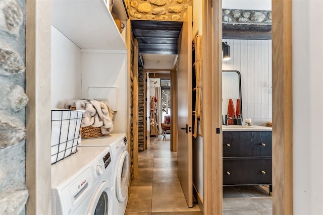 laundry area featuring independent washer and dryer and tile patterned flooring