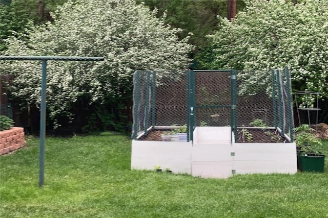 view of gate featuring a lawn