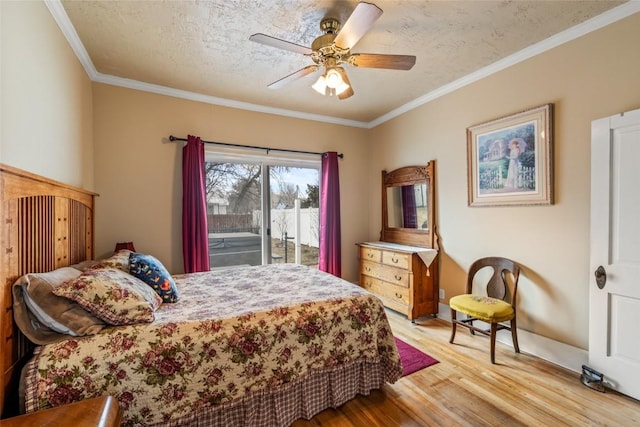 bedroom with ceiling fan, ornamental molding, access to exterior, light wood-style floors, and a textured ceiling