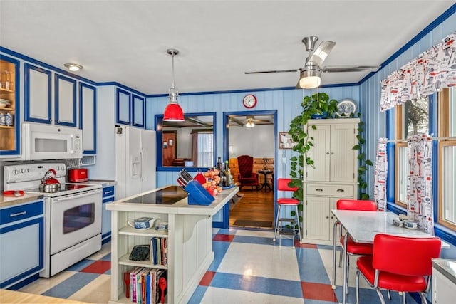 kitchen featuring light floors, light countertops, white appliances, blue cabinets, and a ceiling fan