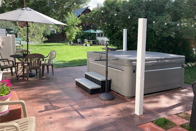 view of patio / terrace featuring outdoor dining area, fence, and a hot tub