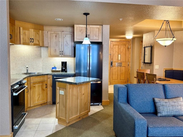 kitchen with decorative light fixtures, a kitchen island, black appliances, sink, and light brown cabinets