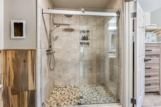 bathroom with hardwood / wood-style flooring, vanity, toilet, and walk in shower