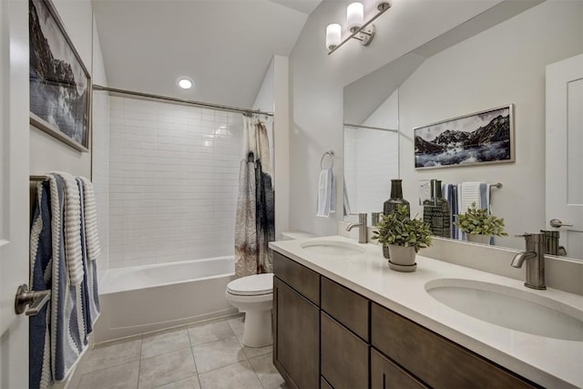 bathroom featuring a sink, toilet, shower / tub combo with curtain, and tile patterned flooring