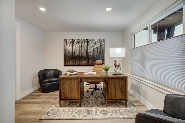 office featuring recessed lighting, baseboards, and wood finished floors