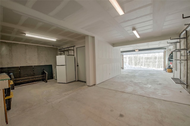 garage with white refrigerator