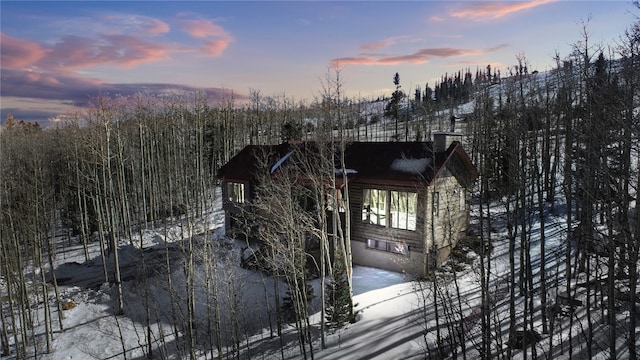 view of snow covered property