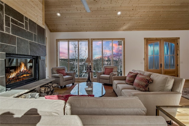 living room featuring hardwood / wood-style flooring, wood ceiling, high vaulted ceiling, and french doors