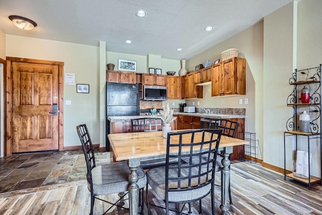 dining space featuring light wood-type flooring