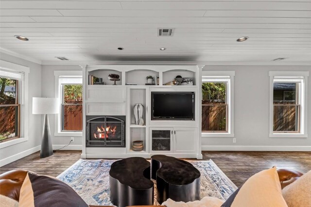 living room featuring dark hardwood / wood-style floors, wooden ceiling, and ornamental molding