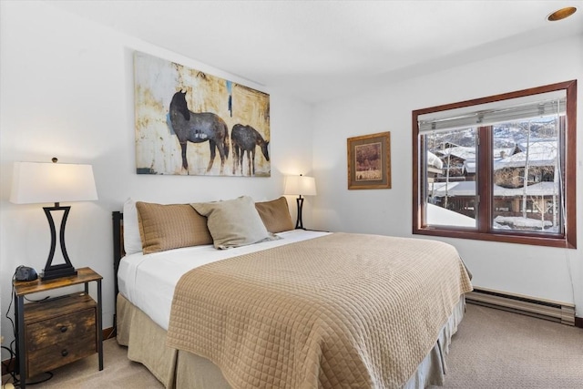 bedroom featuring a baseboard radiator and light colored carpet