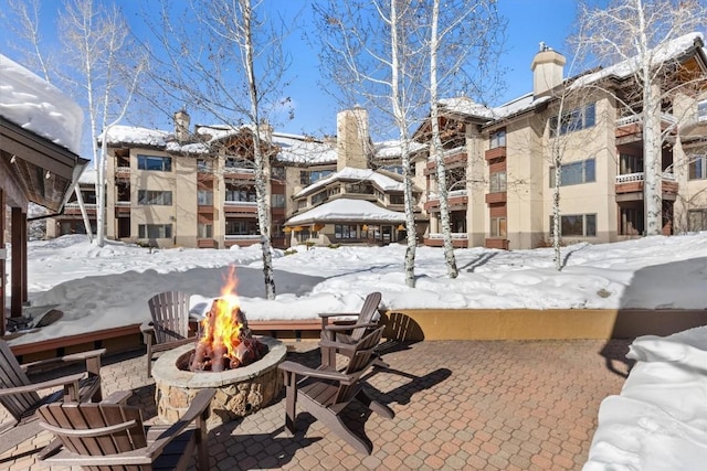 exterior space featuring an outdoor fire pit