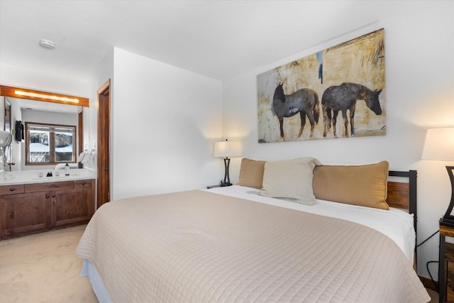 bedroom featuring light colored carpet and ensuite bath