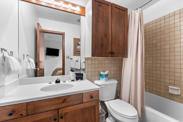 full bathroom featuring toilet, tasteful backsplash, tile walls, vanity, and shower / bath combo