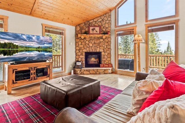 living room with plenty of natural light, a fireplace, wooden ceiling, and wood finished floors