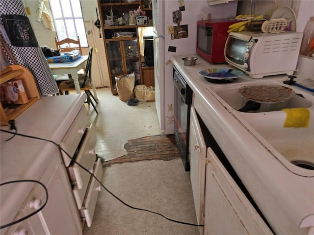 kitchen featuring washer / dryer