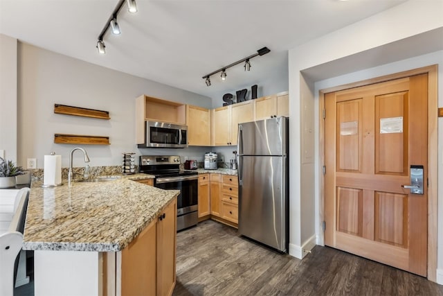 kitchen with light brown cabinetry, open shelves, a sink, stainless steel appliances, and a peninsula