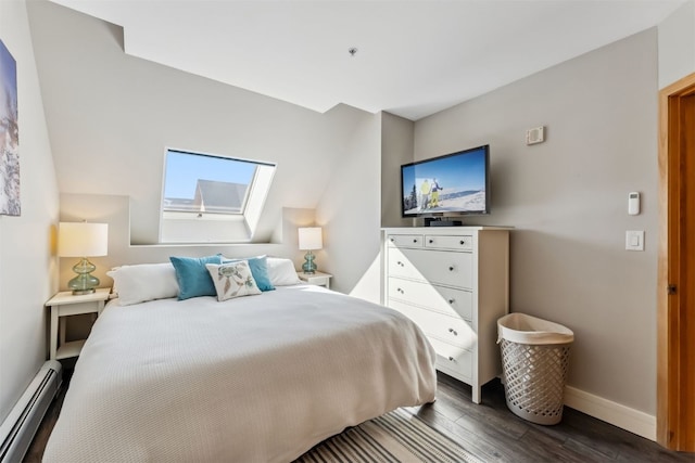 bedroom featuring dark wood finished floors, a skylight, baseboards, and baseboard heating