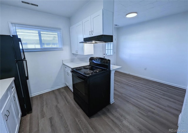 kitchen featuring black appliances, dark hardwood / wood-style flooring, and white cabinetry