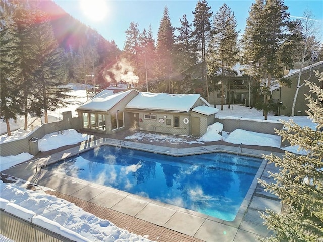 view of snow covered pool