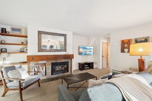 carpeted living room featuring a baseboard heating unit and a tiled fireplace