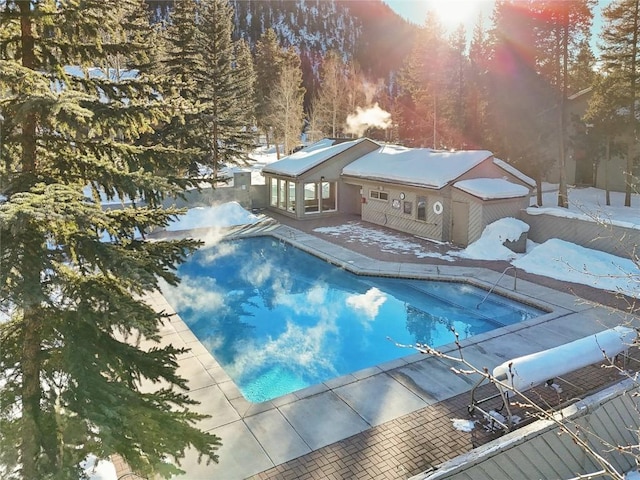 view of snow covered pool