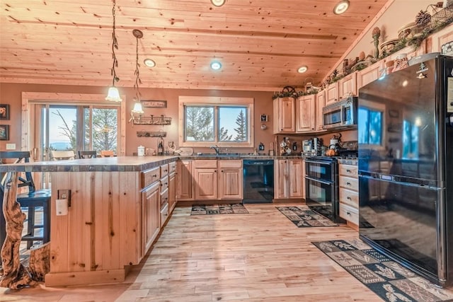 kitchen featuring black appliances, hanging light fixtures, vaulted ceiling, light brown cabinetry, and wood ceiling