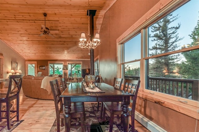 dining room featuring a baseboard heating unit, ceiling fan with notable chandelier, vaulted ceiling, light wood-type flooring, and wood ceiling