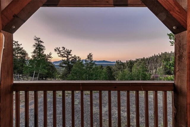 view of balcony at dusk